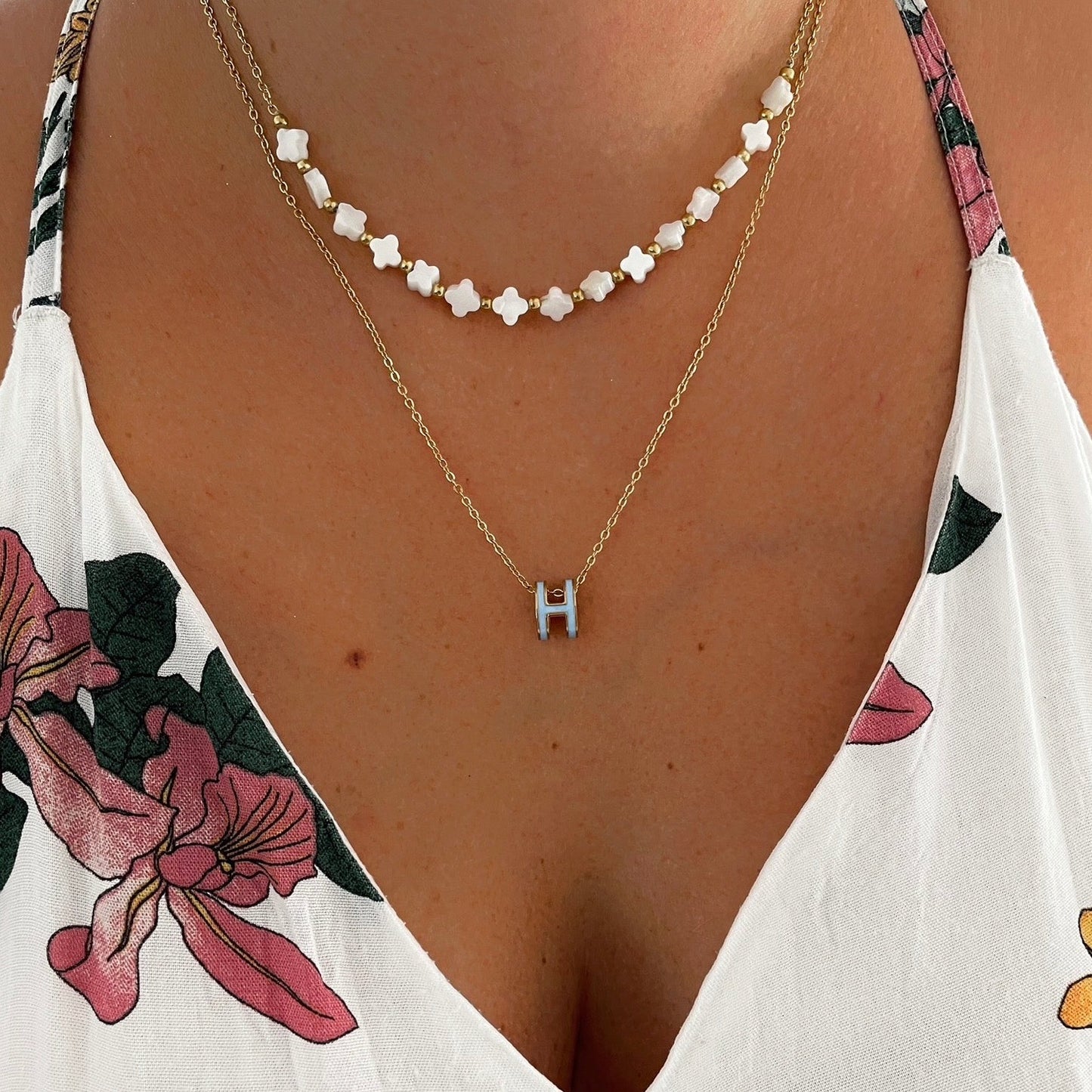 Collier H bleu ciel