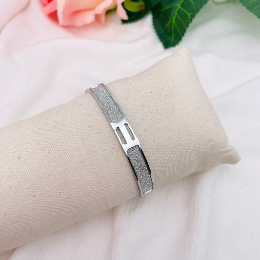 Bracelet jonc H paillettes argenté