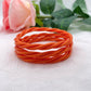 Jonc Bouddhiste torsadé orange